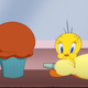 Tweety Bird, decorating cupcakes.